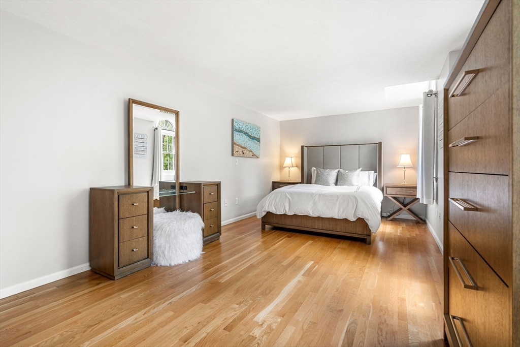 28 Charles Road Groton, MA 01450 - Photo 28 of 42 a bedroom with a bed and wooden floor