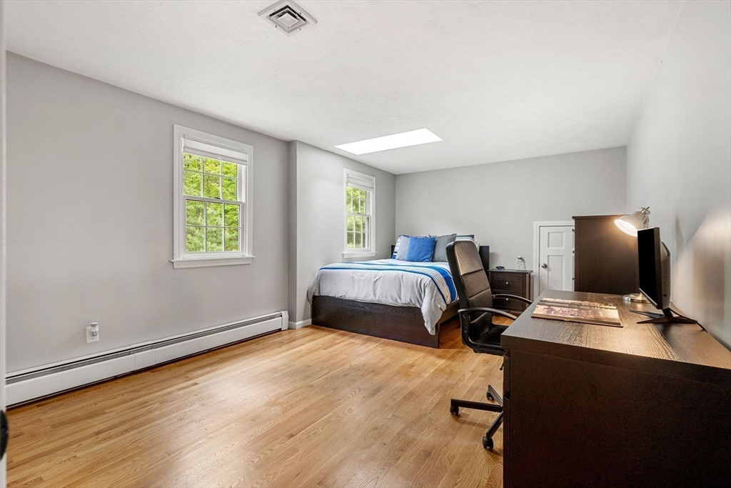 28 Charles Road Groton, MA 01450 - Photo 30 of 42 a bedroom with a bed and a window