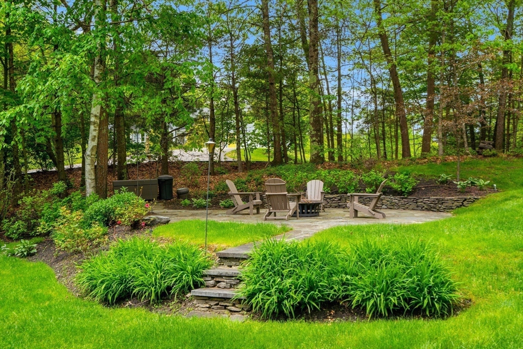 28 Charles Road Groton, MA 01450 - Photo 3 of 42 a view of backyard with swimming pool and seating space