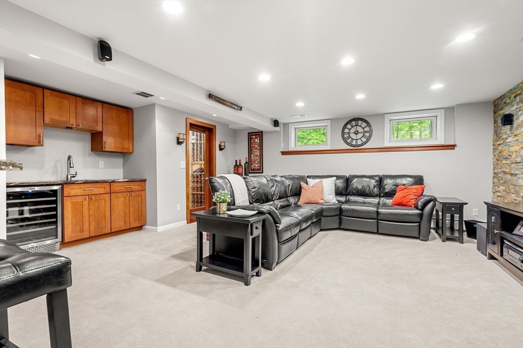 28 Charles Road Groton, MA 01450 - Photo 34 of 42 a living room with furniture and a flat screen tv