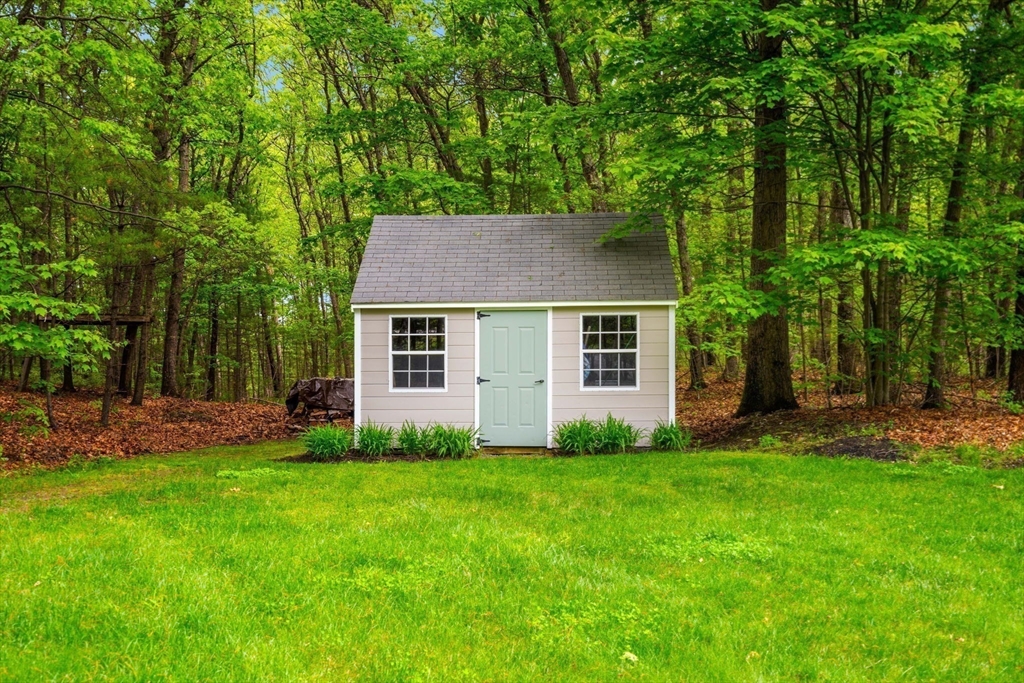 28 Charles Road Groton, MA 01450 - Photo 37 of 42 a view of a house with a yard and sitting area