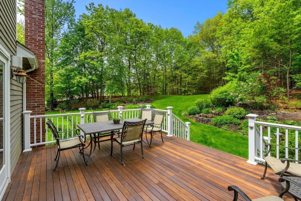 28 Charles Road Groton, MA 01450 - Photo 39 of 42 a view of a chairs and table on the wooden floor