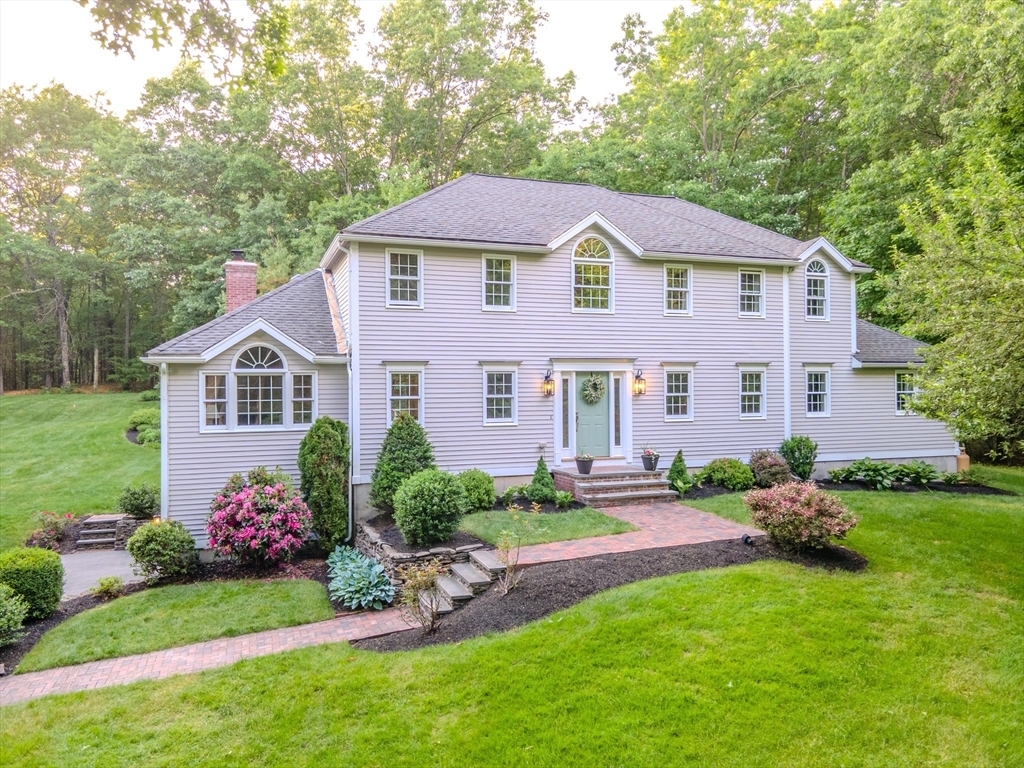28 Charles Road Groton, MA 01450 - Photo 40 of 42 a front view of a house with a yard