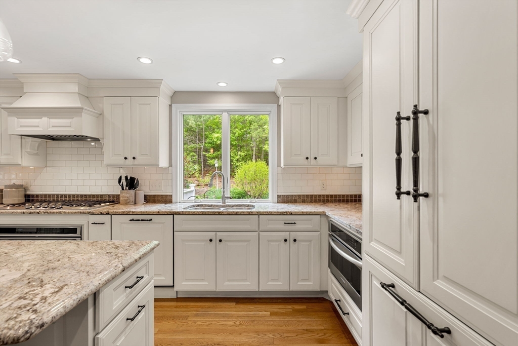 28 Charles Road Groton, MA 01450 - Photo 5 of 42 a kitchen with a sink stove and cabinets