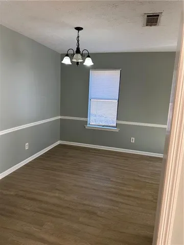 a view of a livingroom with a kitchen
