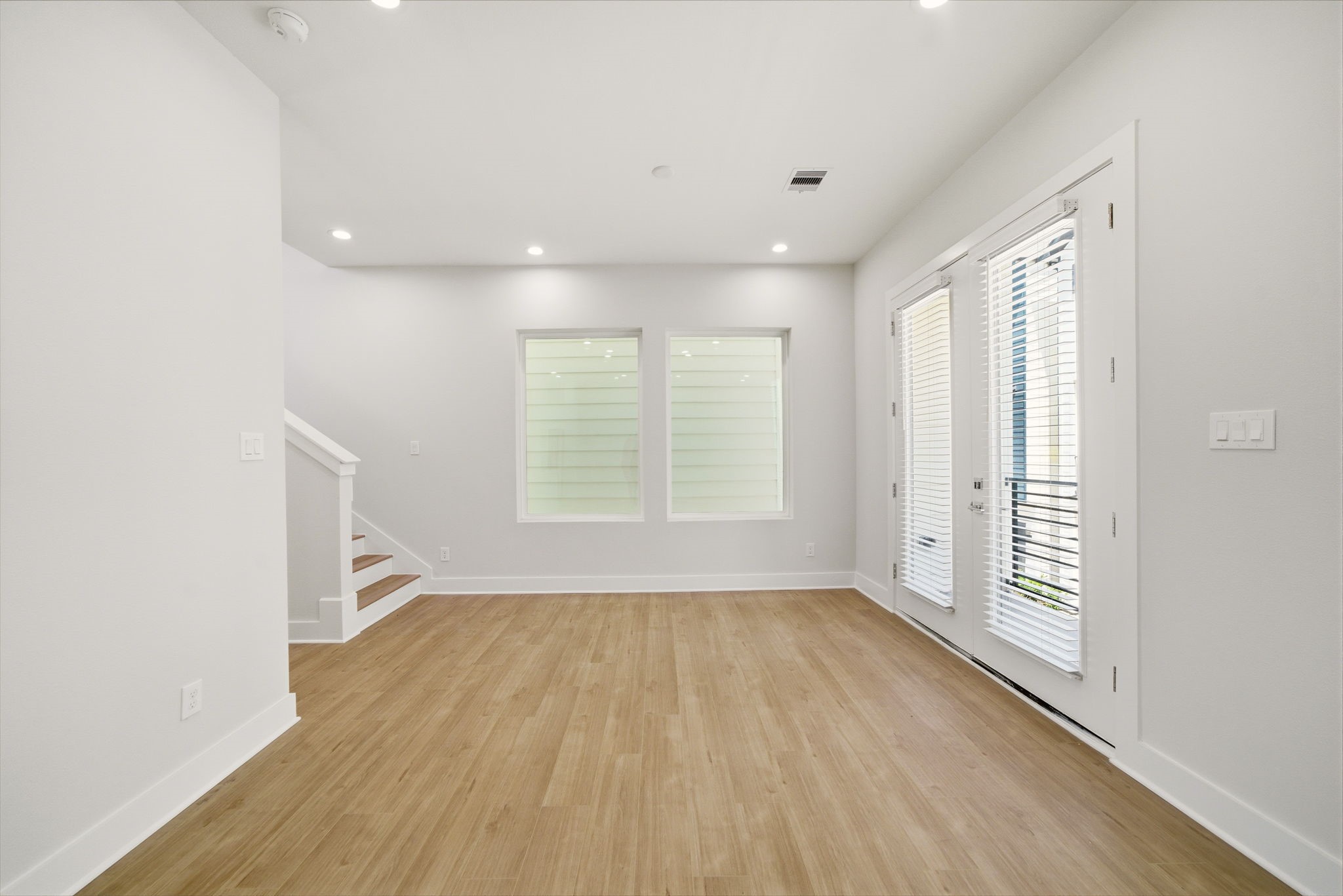 1398 Cedar Post Lane Houston, TX 77080 - Photo 7 of 33 wooden floor in an empty room with a window