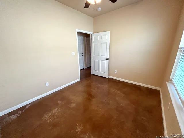 an empty room with a empty space and a window