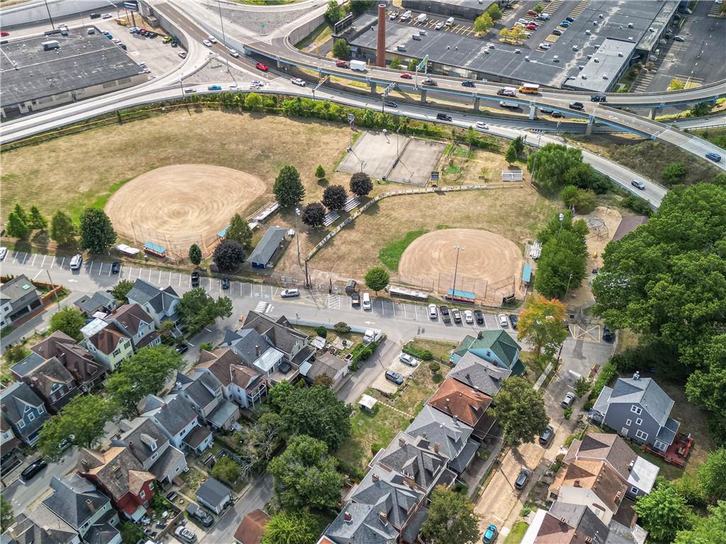 33 5th Street Pittsburgh, PA 15215 - Photo 29 of 32 an aerial view of a swimming pool with outdoor seating and yard