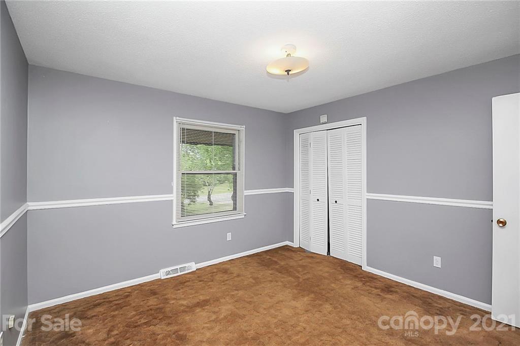 2101 Stallings Road Harrisburg, NC 28075 - Photo 14 of 45 a view of an empty room and window