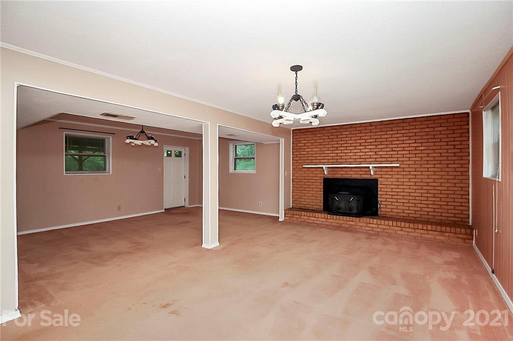 2101 Stallings Road Harrisburg, NC 28075 - Photo 20 of 45 a view of an empty room with a fireplace