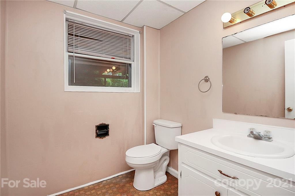 2101 Stallings Road Harrisburg, NC 28075 - Photo 22 of 45 a bathroom with a toilet a sink and mirror
