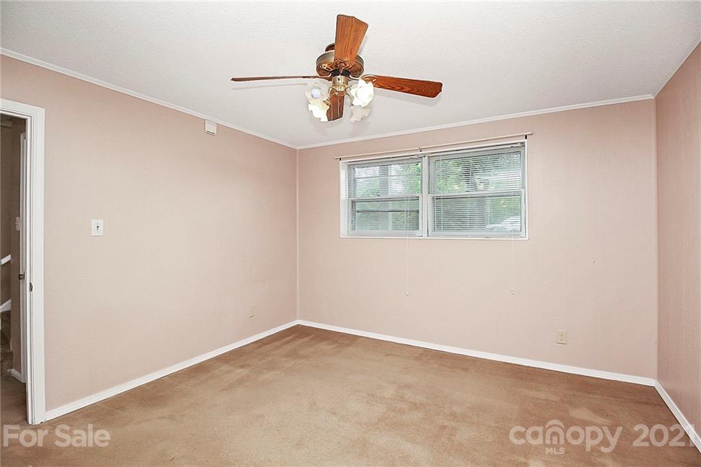 2101 Stallings Road Harrisburg, NC 28075 - Photo 25 of 45 an empty room with a window