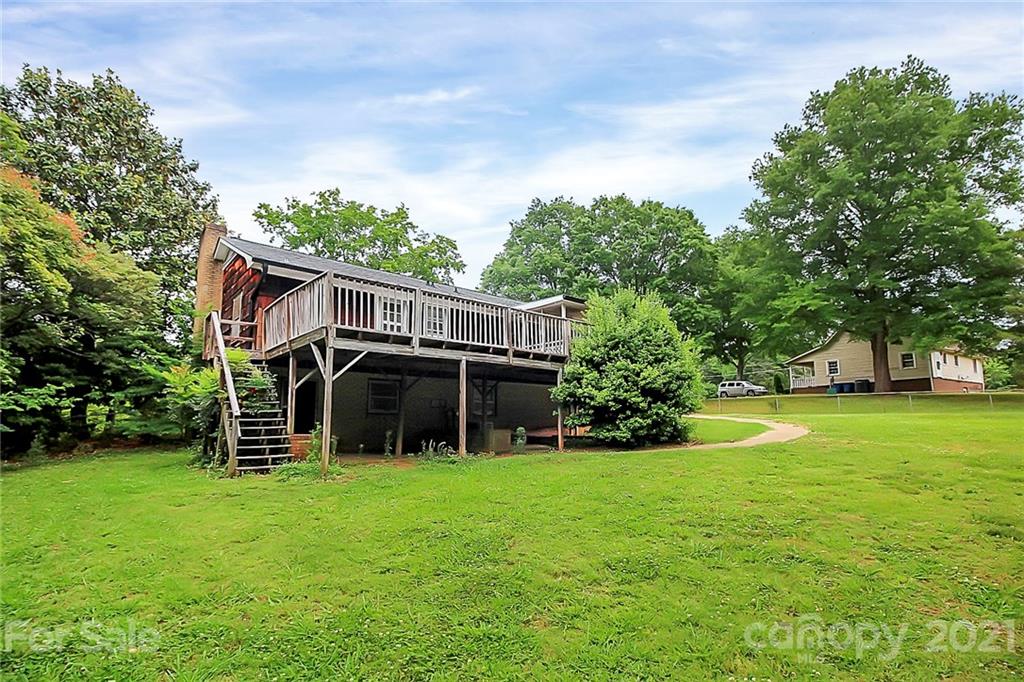 2101 Stallings Road Harrisburg, NC 28075 - Photo 29 of 45 a view of a house with a yard