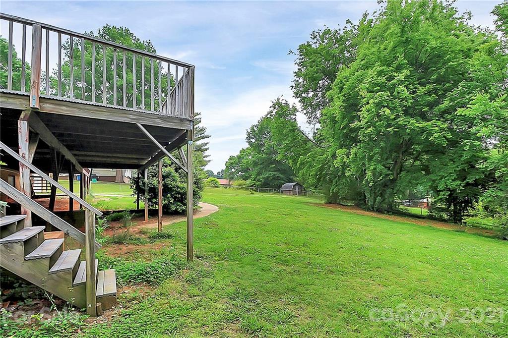 2101 Stallings Road Harrisburg, NC 28075 - Photo 30 of 45 a view of a chair and table in the garden