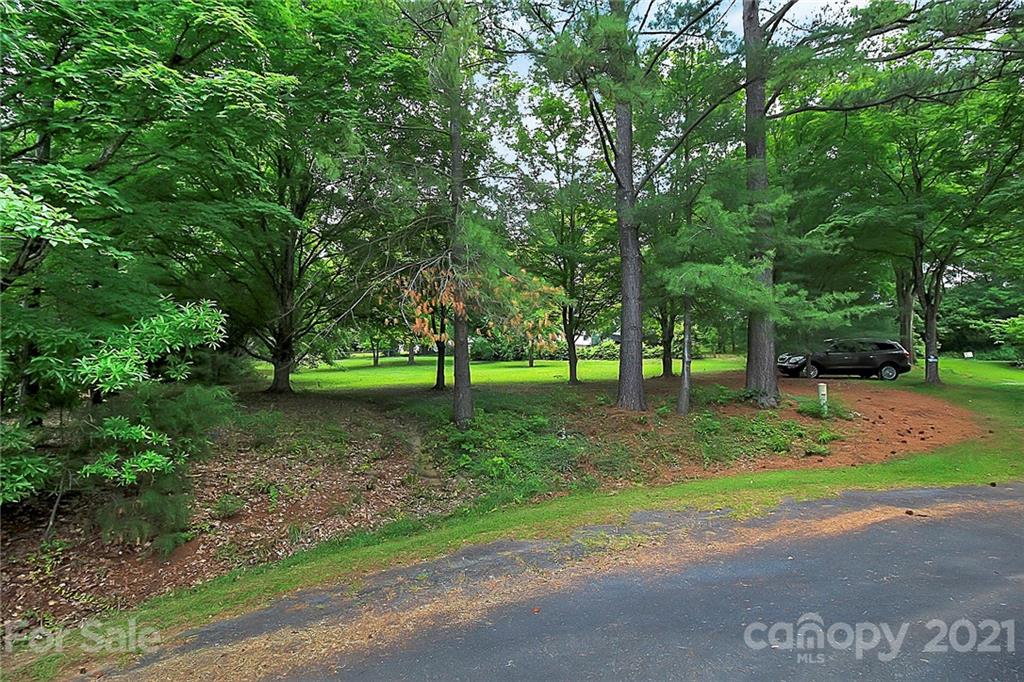 2101 Stallings Road Harrisburg, NC 28075 - Photo 34 of 45 a view of green field with trees