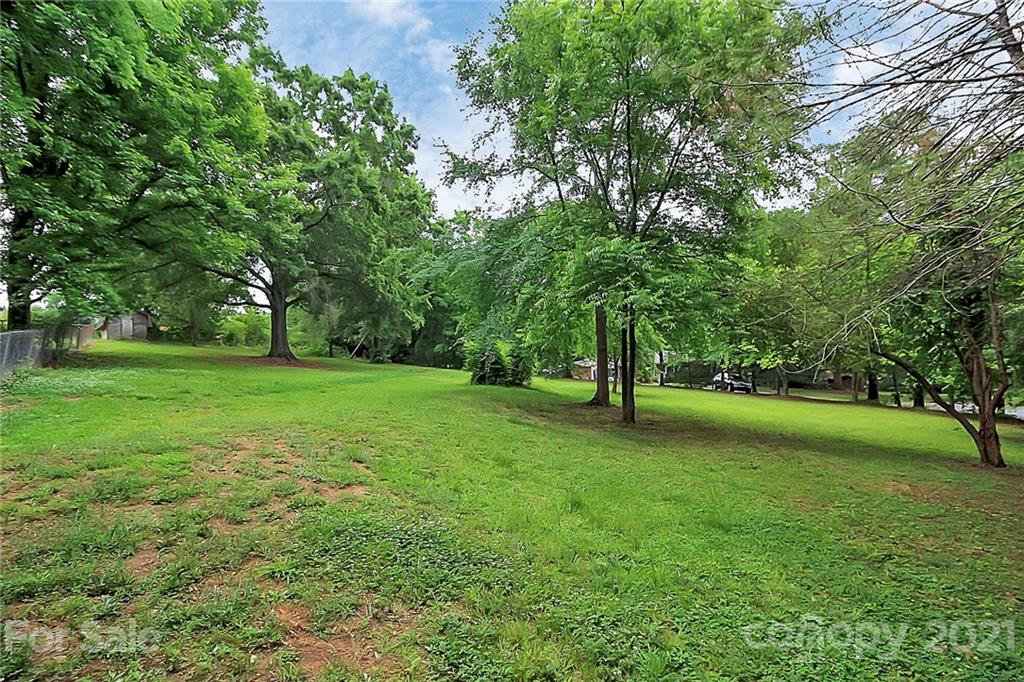 2101 Stallings Road Harrisburg, NC 28075 - Photo 40 of 45 a view of grassy field with trees