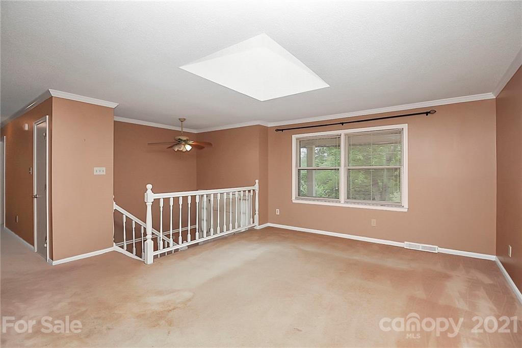 2101 Stallings Road Harrisburg, NC 28075 - Photo 5 of 45 a view of an empty room with a window