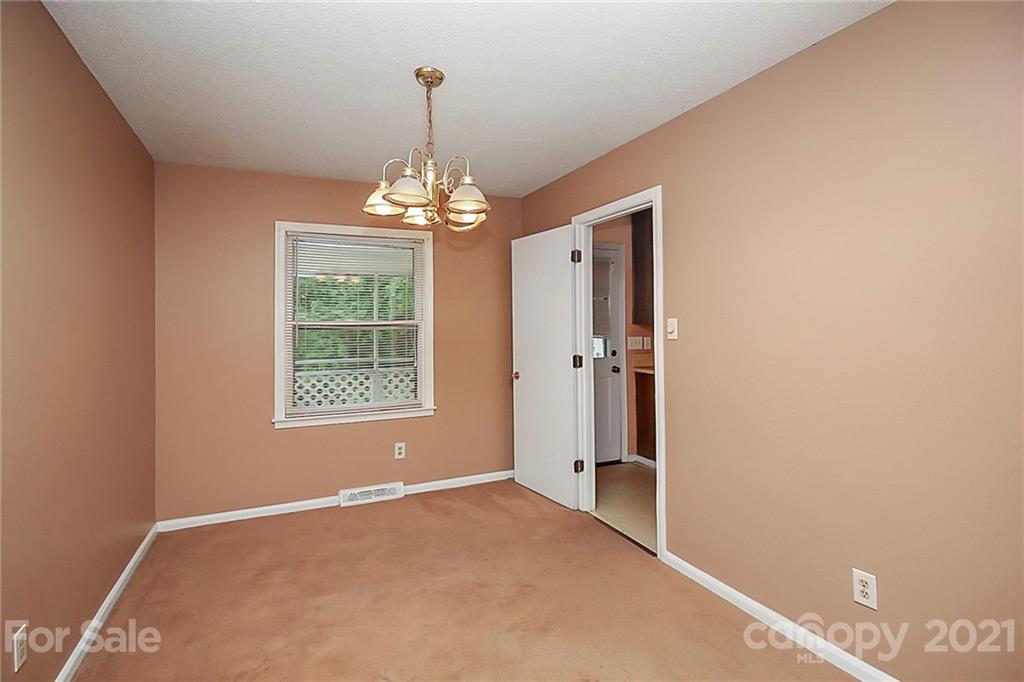 2101 Stallings Road Harrisburg, NC 28075 - Photo 7 of 45 a view of a chandelier in big room and chandelier