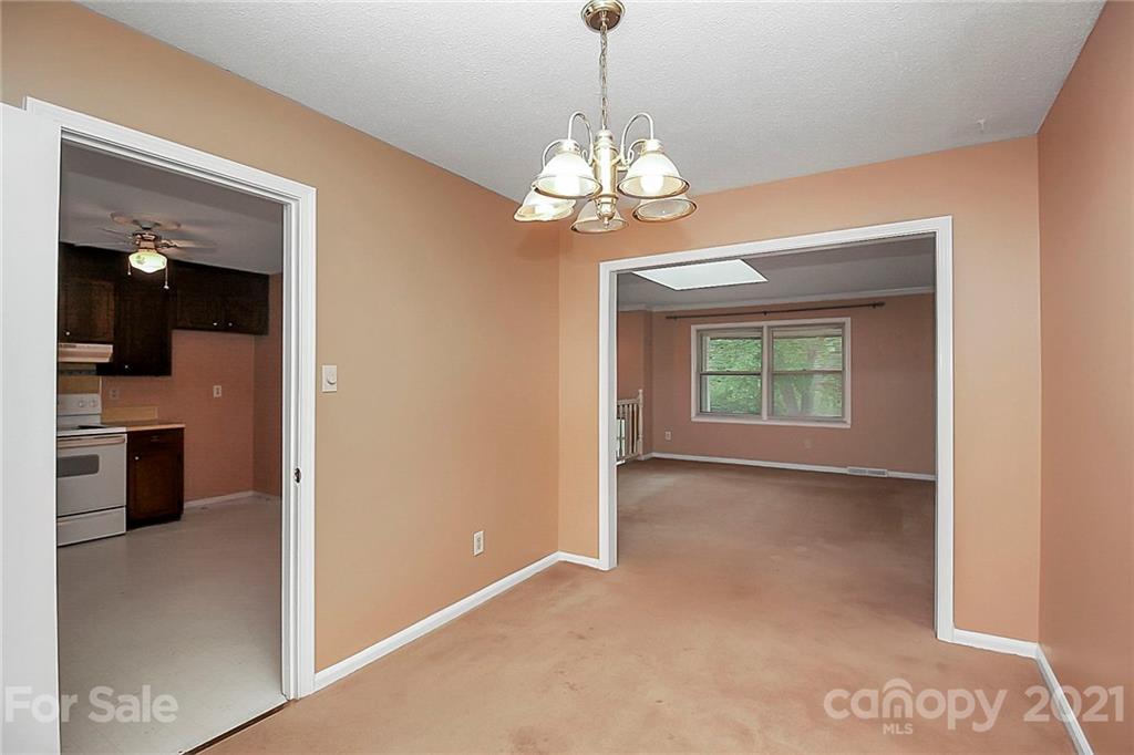 2101 Stallings Road Harrisburg, NC 28075 - Photo 8 of 45 a view of an empty room with a window