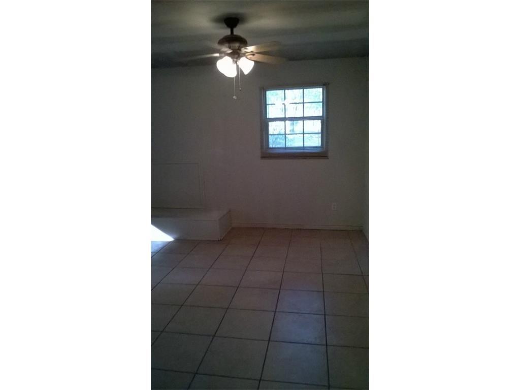 266 James Fannin Road Honey Grove, TX 75446 - Photo 5 of 11 a view of an empty room with a window
