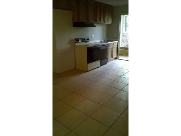 a kitchen with a sink and a stove