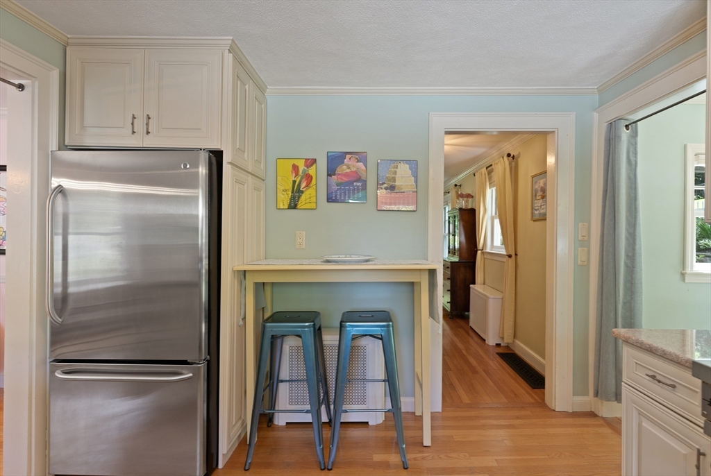 2 Parkwood Road Lynnfield, MA 01940 - Photo 11 of 37 a kitchen with a refrigerator and a table