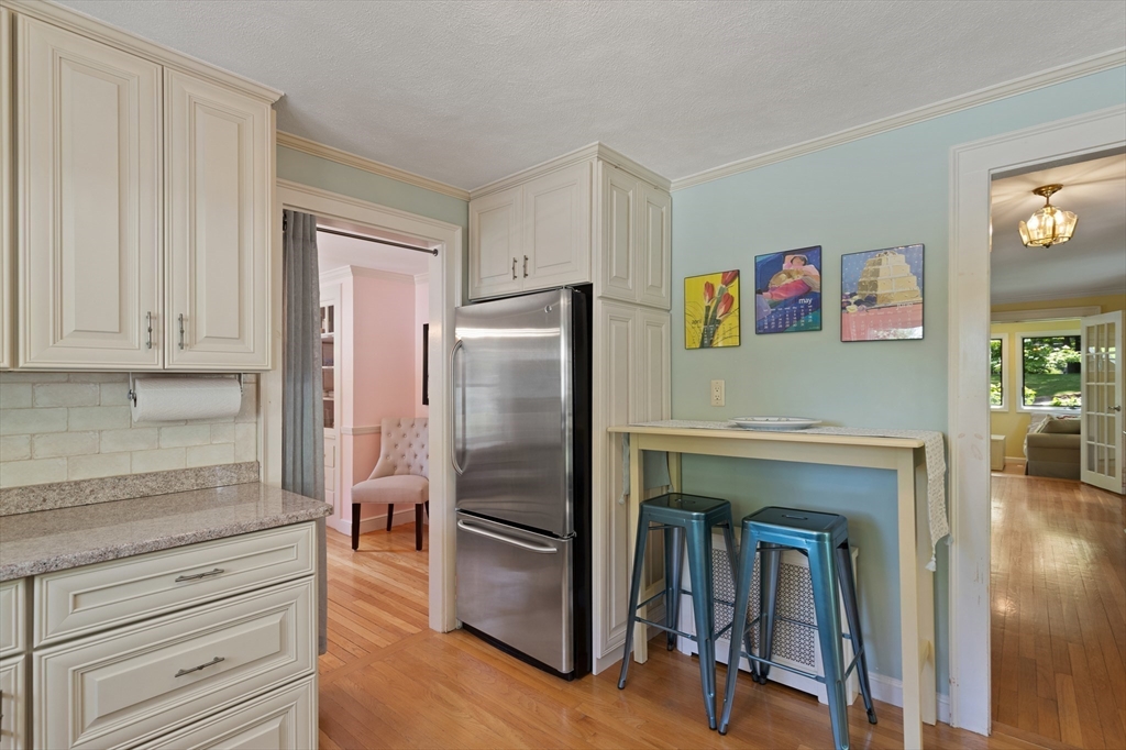 2 Parkwood Road Lynnfield, MA 01940 - Photo 12 of 37 a kitchen with windows and a refrigerator