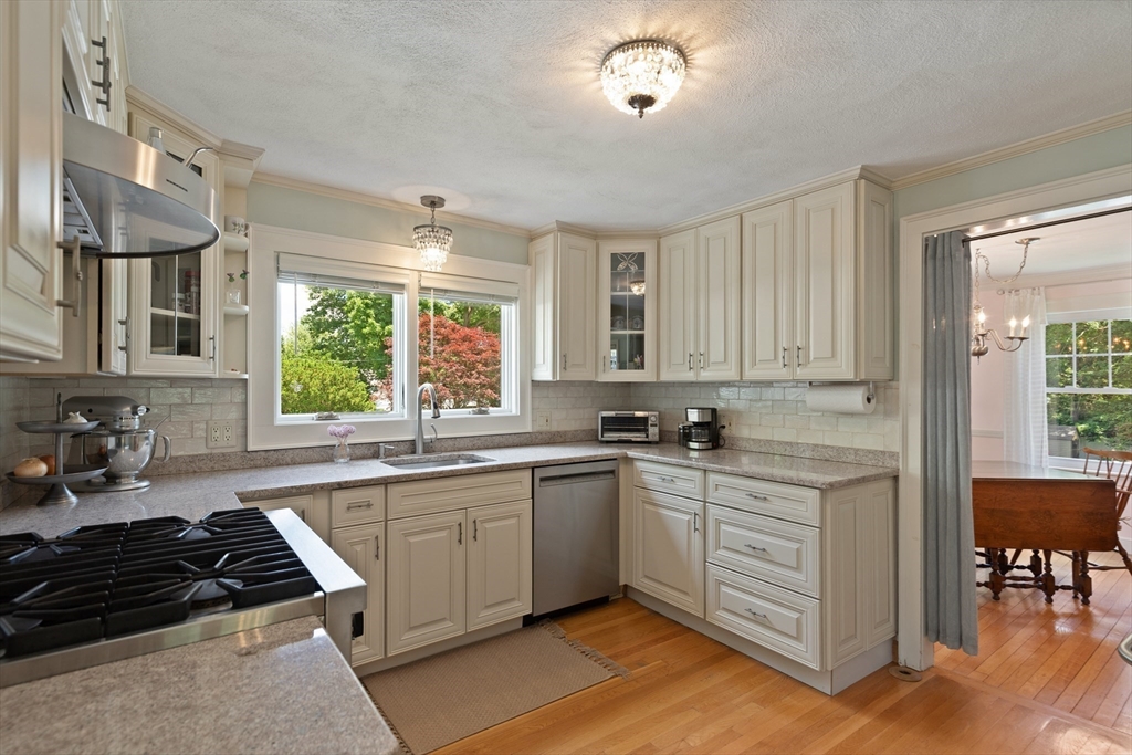 2 Parkwood Road Lynnfield, MA 01940 - Photo 14 of 37 a kitchen with a sink stove and cabinets