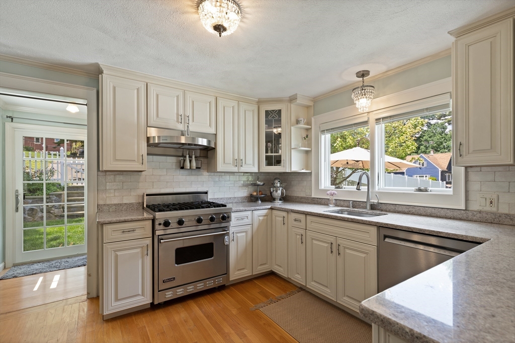 2 Parkwood Road Lynnfield, MA 01940 - Photo 15 of 37 a kitchen with a stove a sink and a window