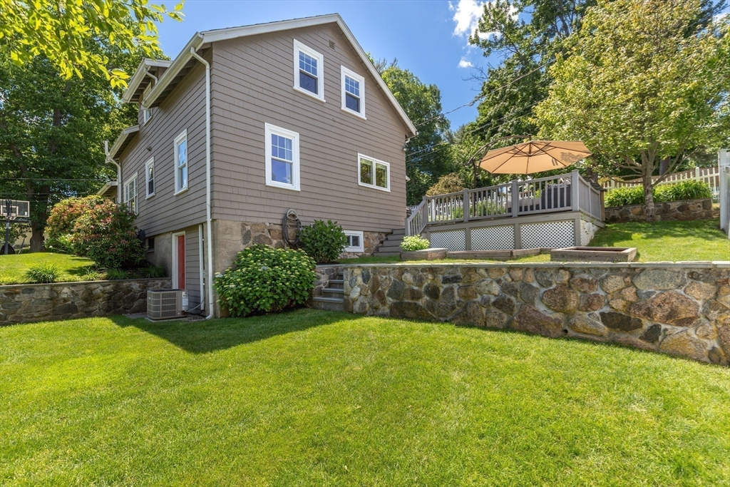 2 Parkwood Road Lynnfield, MA 01940 - Photo 2 of 37 a view of a house with a yard and sitting area