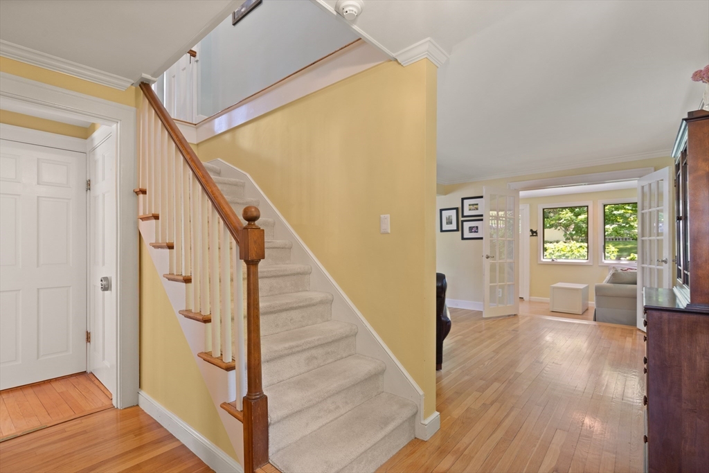 2 Parkwood Road Lynnfield, MA 01940 - Photo 21 of 37 a view of an entryway with wooden floor and stairs