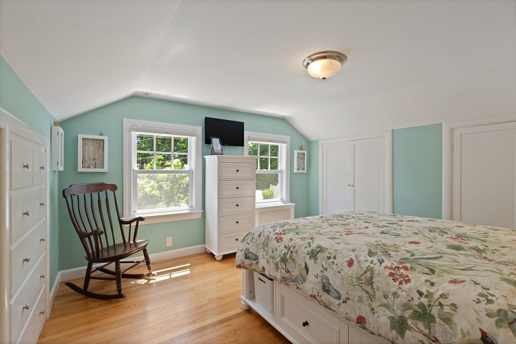 2 Parkwood Road Lynnfield, MA 01940 - Photo 23 of 37 a bedroom with a bed and a chair
