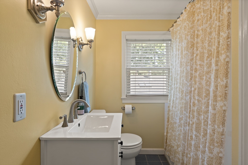 2 Parkwood Road Lynnfield, MA 01940 - Photo 26 of 37 a bathroom with a toilet a sink and a mirror