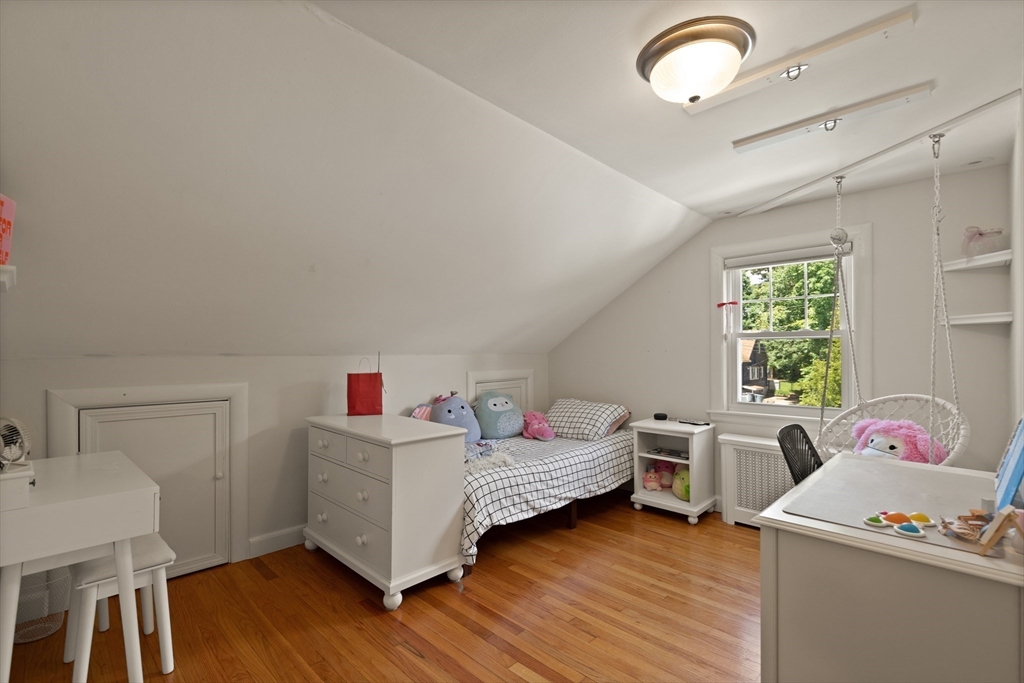 2 Parkwood Road Lynnfield, MA 01940 - Photo 27 of 37 a living room with baby crib furniture and a window