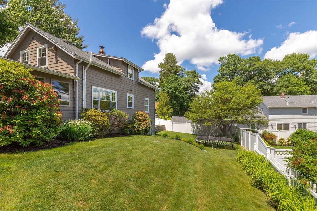 2 Parkwood Road Lynnfield, MA 01940 - Photo 33 of 37 a front view of a house with garden