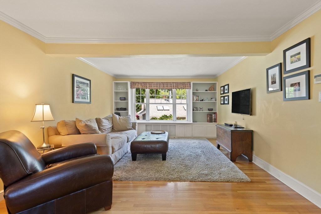 2 Parkwood Road Lynnfield, MA 01940 - Photo 7 of 37 a living room with furniture wooden floor and a flat screen tv