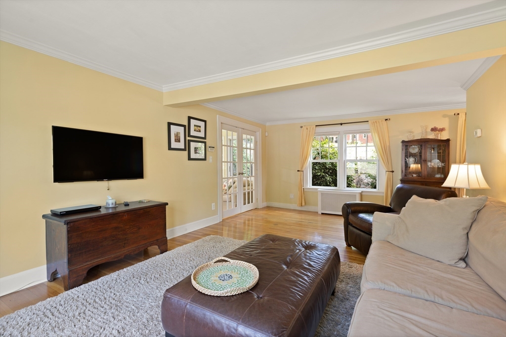 2 Parkwood Road Lynnfield, MA 01940 - Photo 9 of 37 a living room with furniture and a flat screen tv