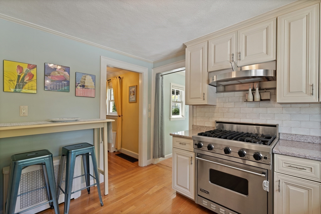 2 Parkwood Road Lynnfield, MA 01940 - Photo 10 of 37 a kitchen with granite countertop a stove and a refrigerator