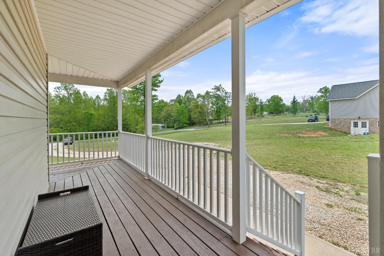 365 Beeks Lane Spout Spring, VA 24593 - Photo 3 of 52 a view of a deck with a big yard potted plants and large tree