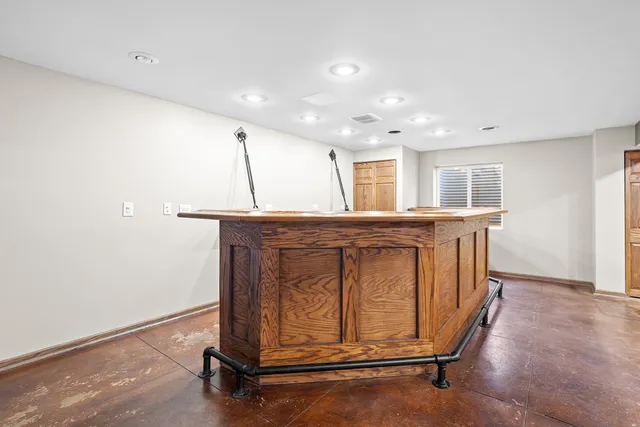 a bathroom with a sink toilet vanity and shower