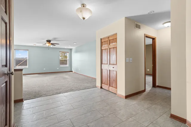 an empty room with a empty space and windows