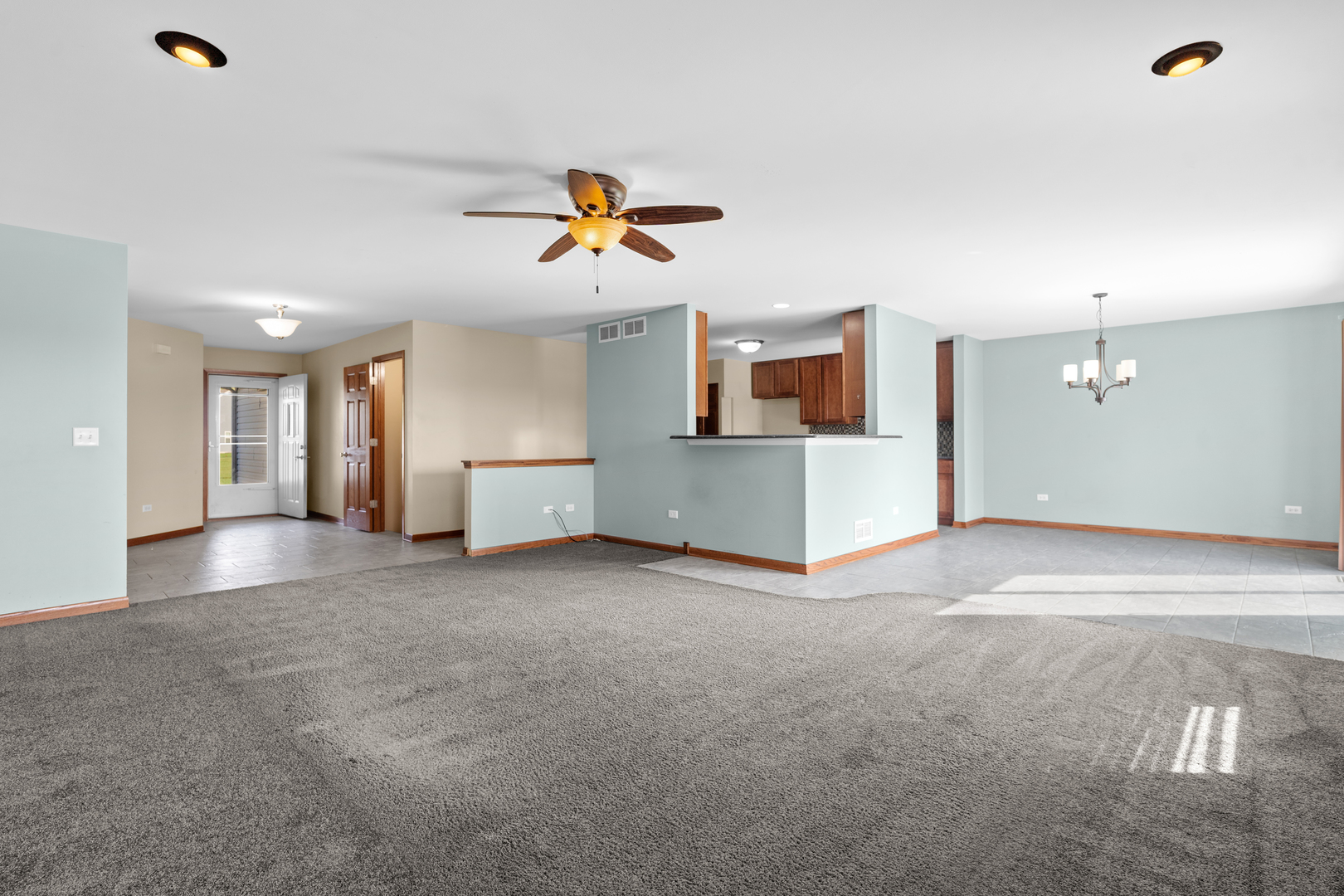 114 International Way Joliet, IL 60421 - Photo 9 of 31 a view of a room with a kitchen and a sink