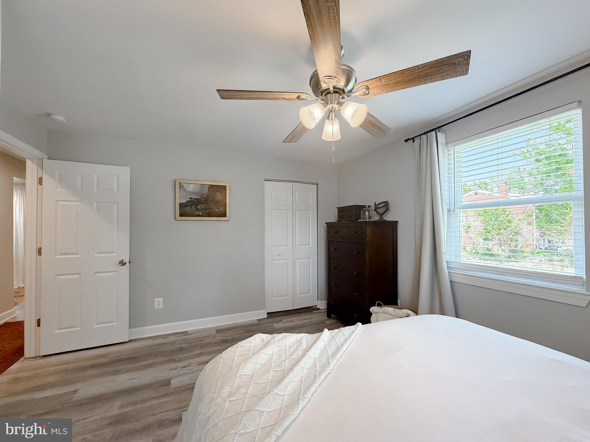 4985 Solomons Island Road Huntingtown, MD 20639 - Photo 17 of 50 a bedroom with a bed and a window