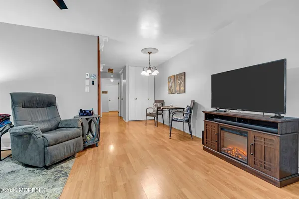 a bedroom with a bed and a lamp on table