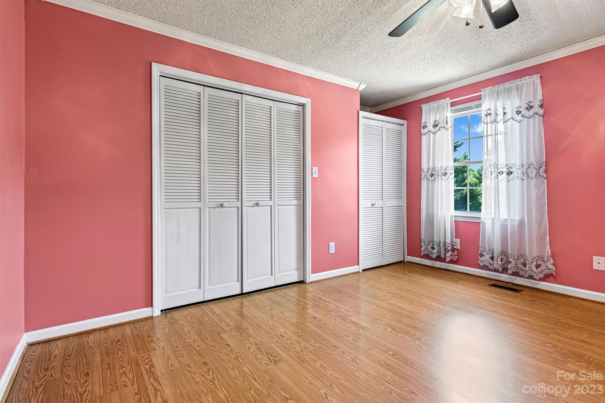 5327 Lee Cline Road Conover, NC 28613 - Photo 16 of 36 an empty room with wooden floor and windows