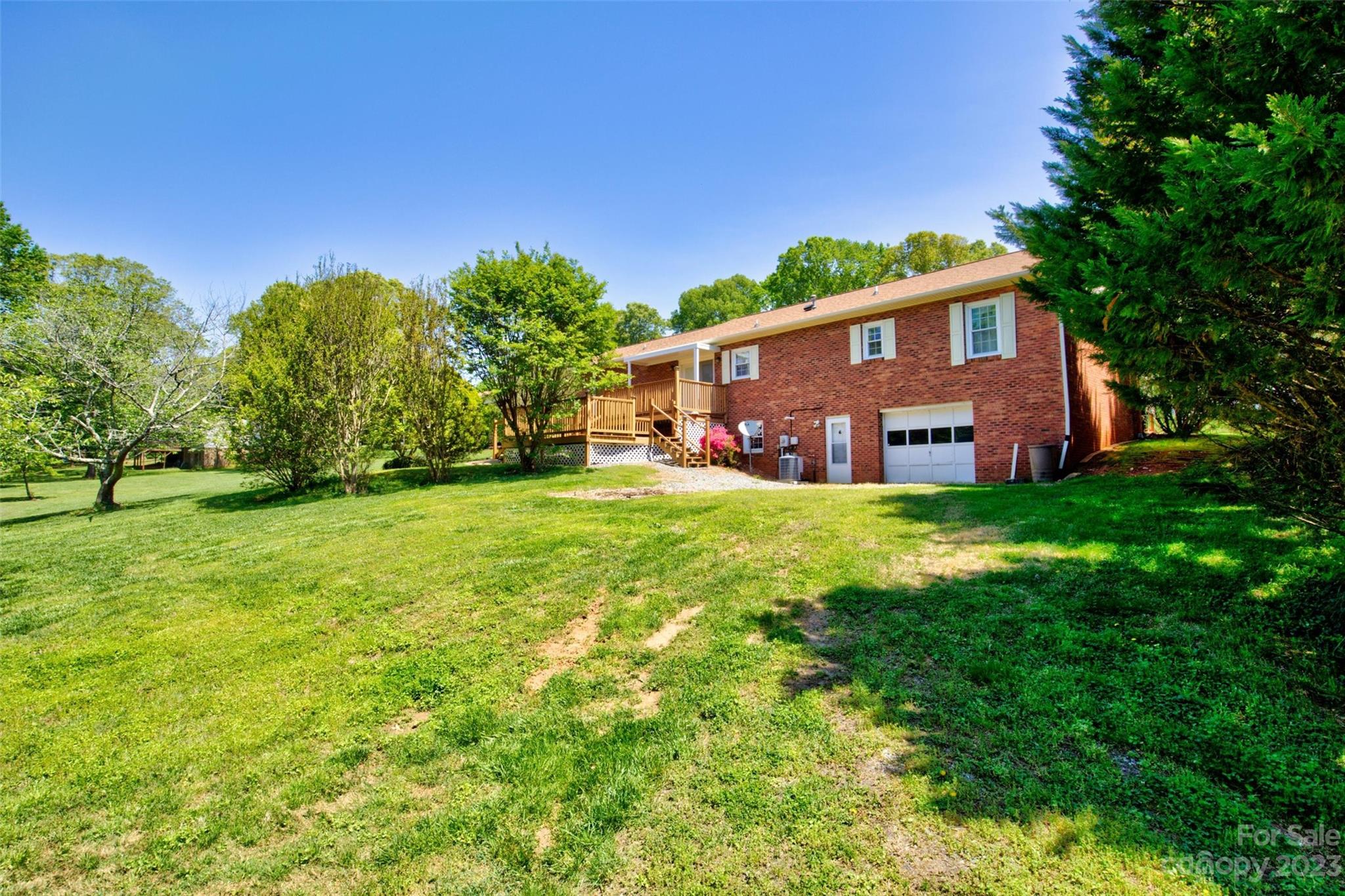 5327 Lee Cline Road Conover, NC 28613 - Photo 34 of 36 a front view of house with yard and trees in the background