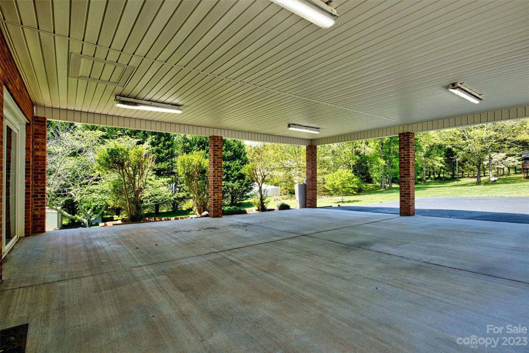 5327 Lee Cline Road Conover, NC 28613 - Photo 36 of 36 a view of a room with large windows and plants