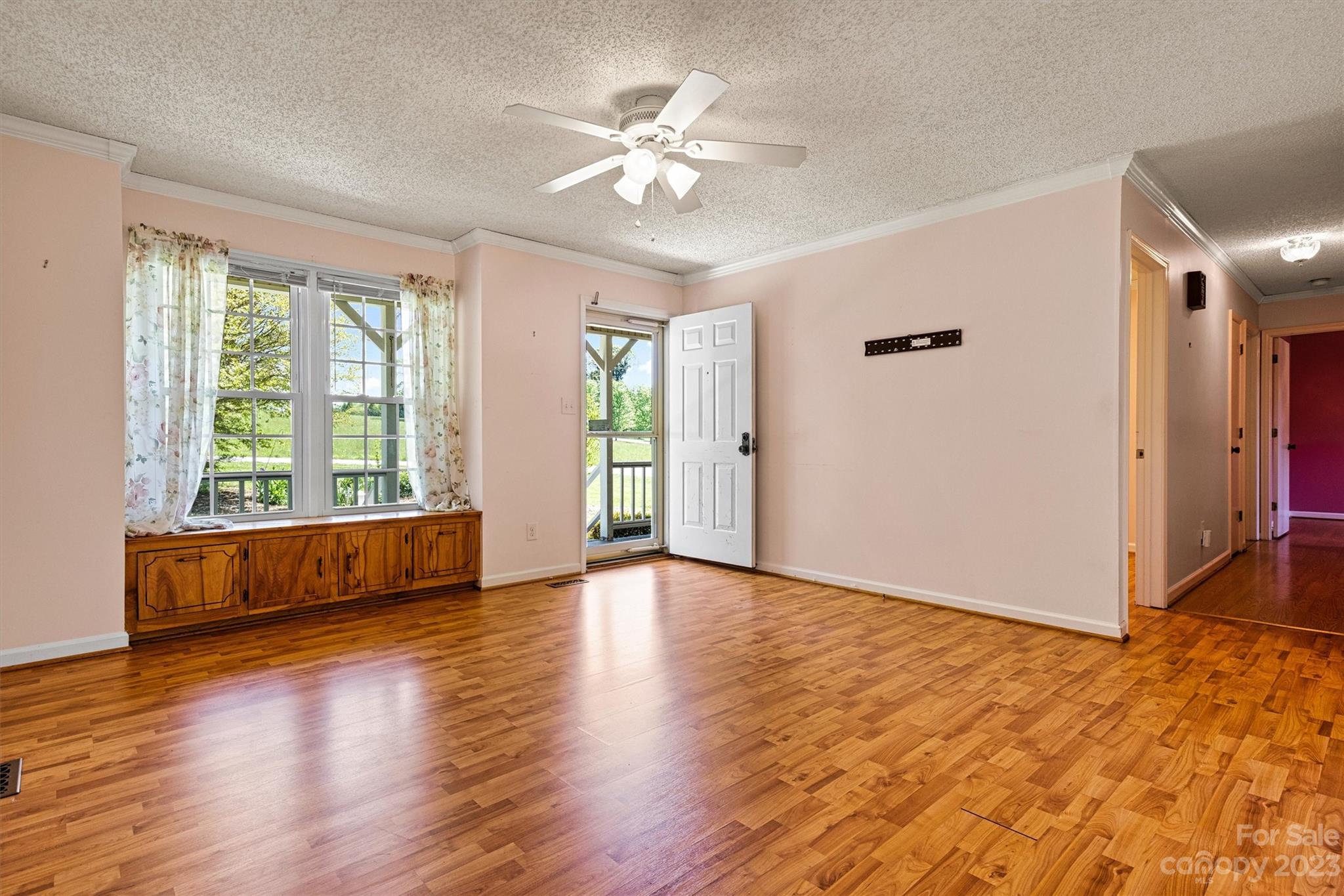 5327 Lee Cline Road Conover, NC 28613 - Photo 7 of 36 a view of an empty room with window and wooden floor