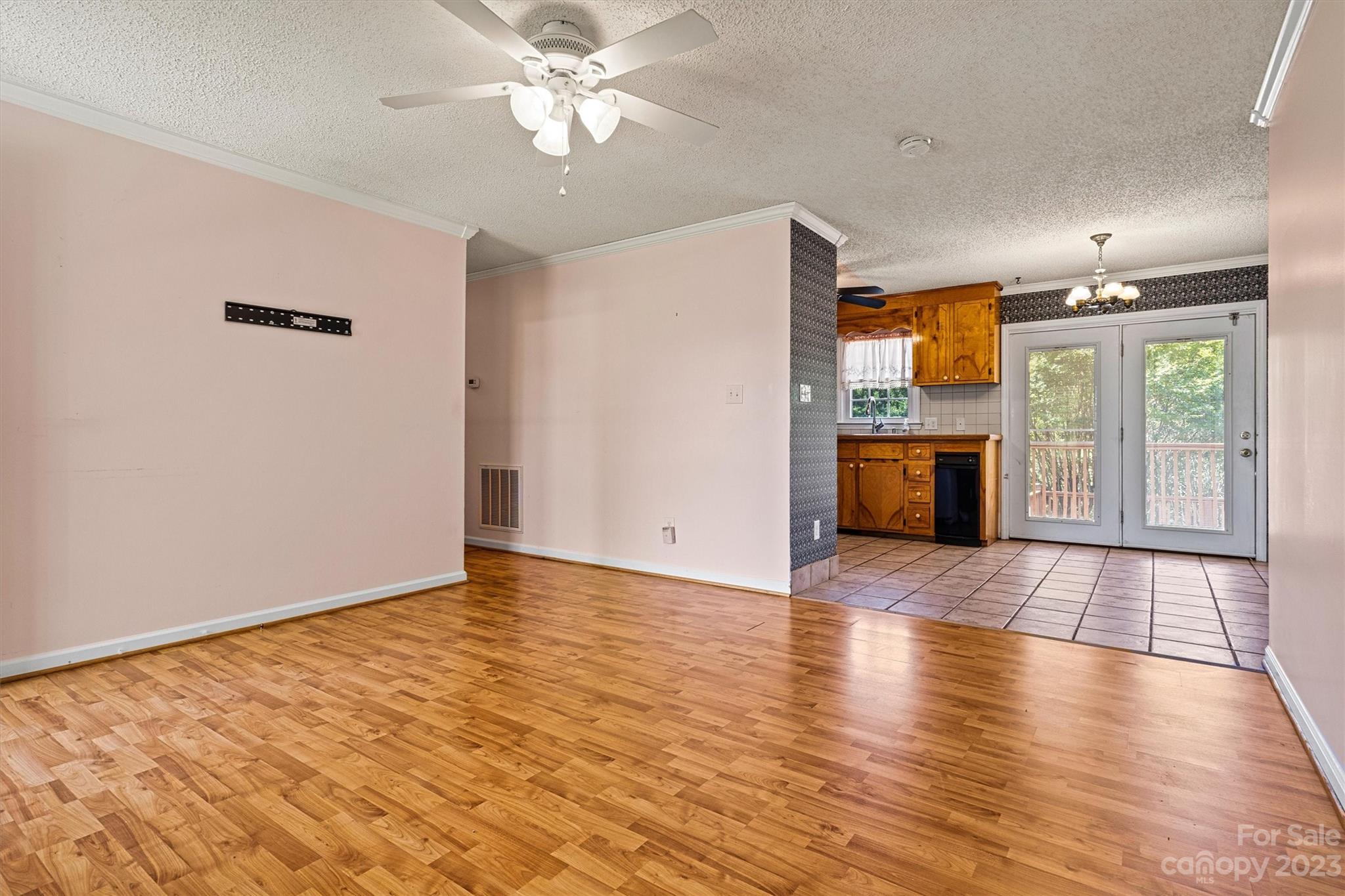 5327 Lee Cline Road Conover, NC 28613 - Photo 8 of 36 a view of empty room with wooden floor and fan