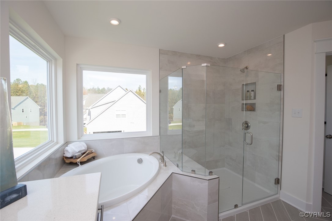 9106 Copplestone Road Chesterfield, VA 23832 - Photo 23 of 49 a bathroom with a bathtub and a shower